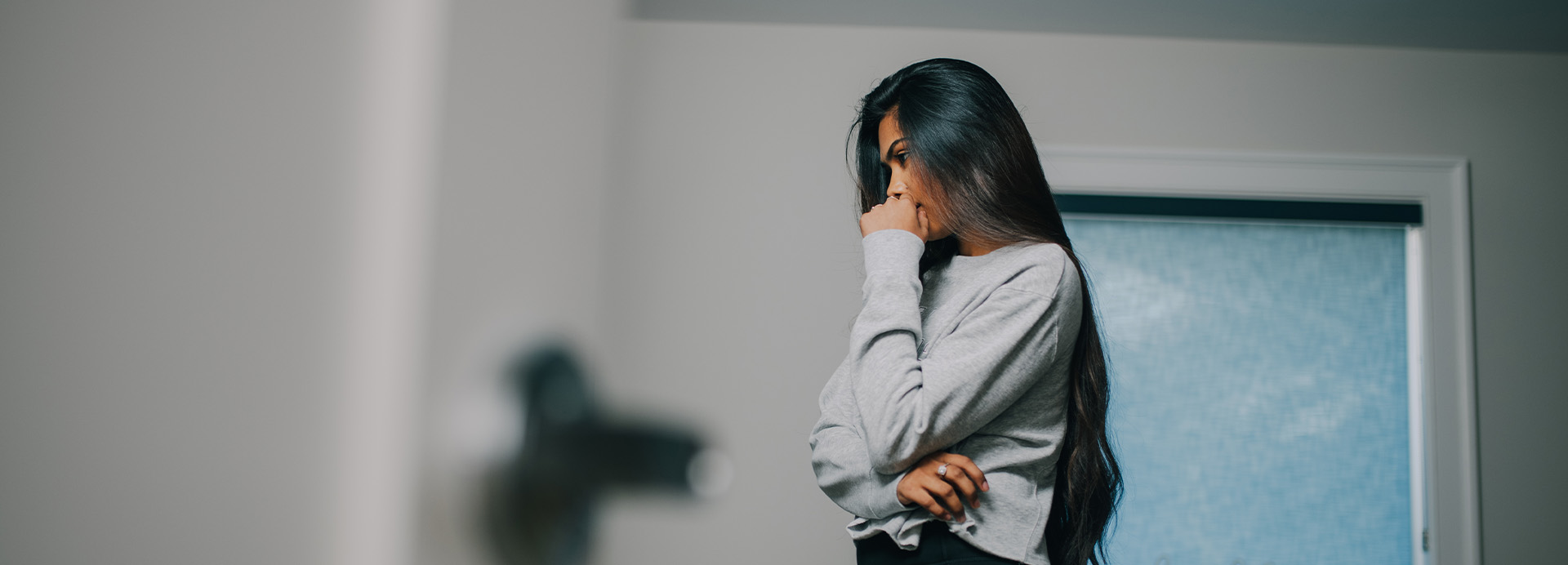Woman patient in her quarters dealing with depression effects.