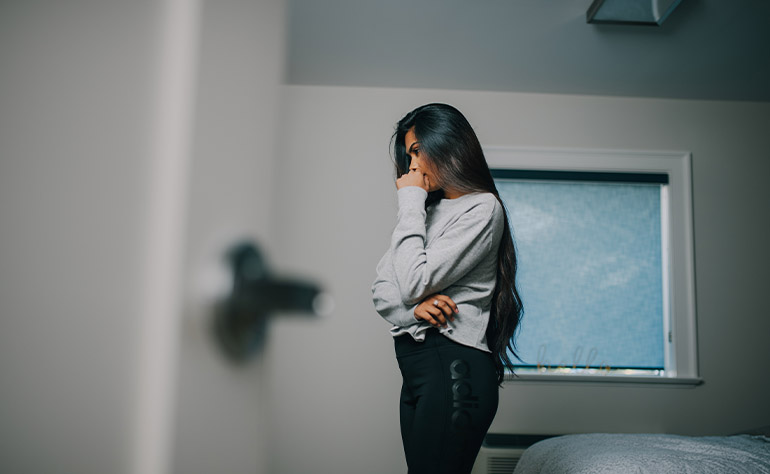 Woman patient in her quarters dealing with depression effects.